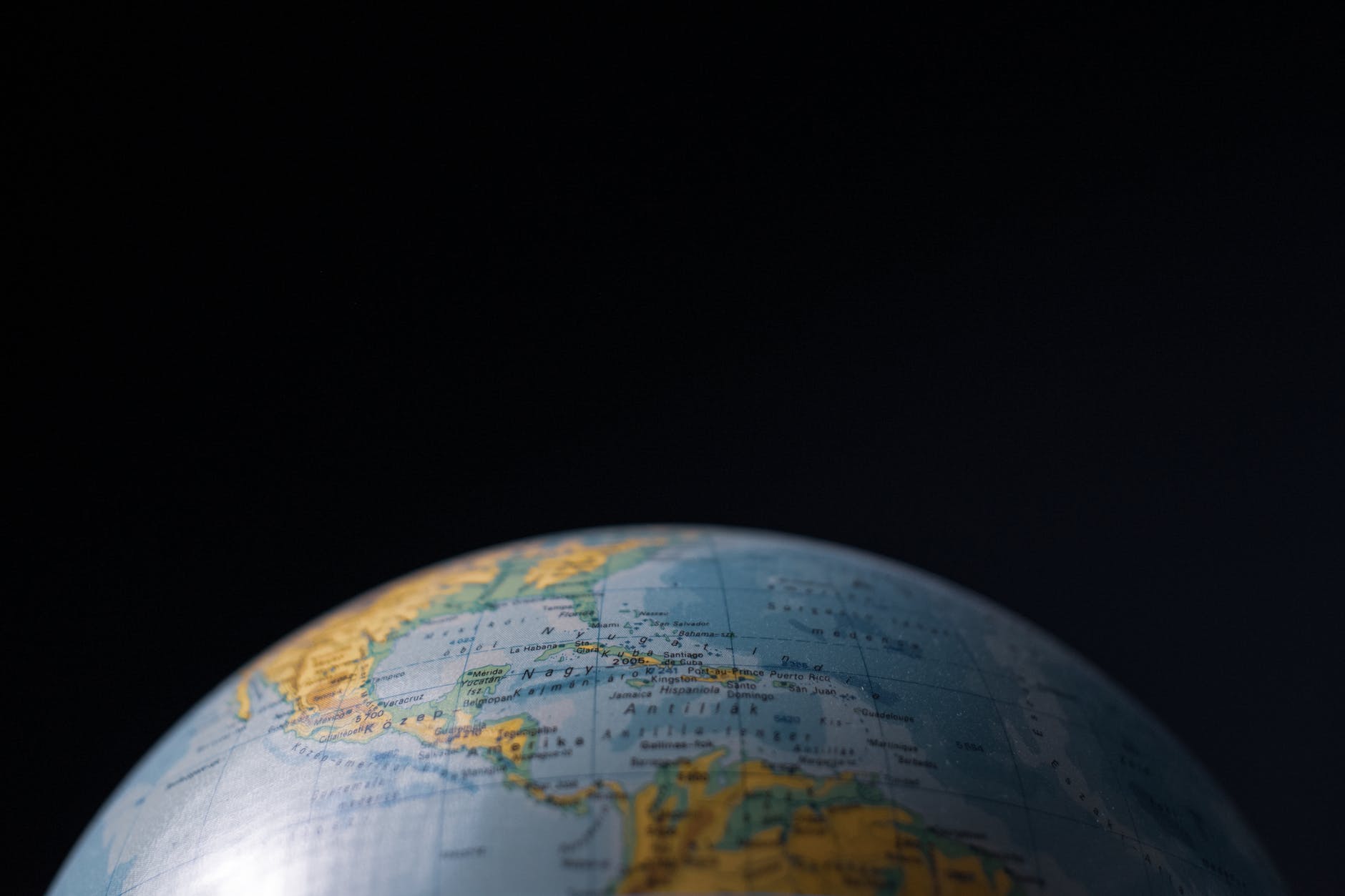 desk globe against black background